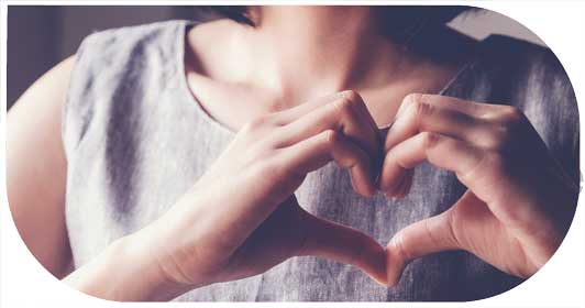 image for corporate social responsibility in customer centric recruitment showing young woman making a heart shape with her hands